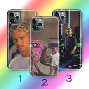 May include: Three different phone cases featuring images from the movie The Fast and the Furious. The first case features a close-up of actor Paul Walker. The second case features a pink car and a woman in a pink outfit. The third case features a green car and actor Paul Walker.