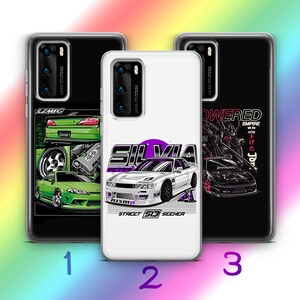 May include: Three phone cases with different designs. The first case is black with a green car and the text "LZMFG". The second case is white with a purple and white car and the text "SILVIA STREET 513 SEEHER". The third case is black with a black and white car and the text "POWERED EMPIRE".
