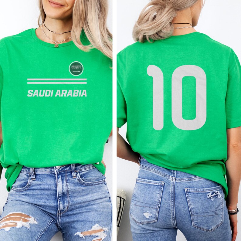 A woman wearing a green t-shirt with the number 10 on it, paired with distressed jeans.