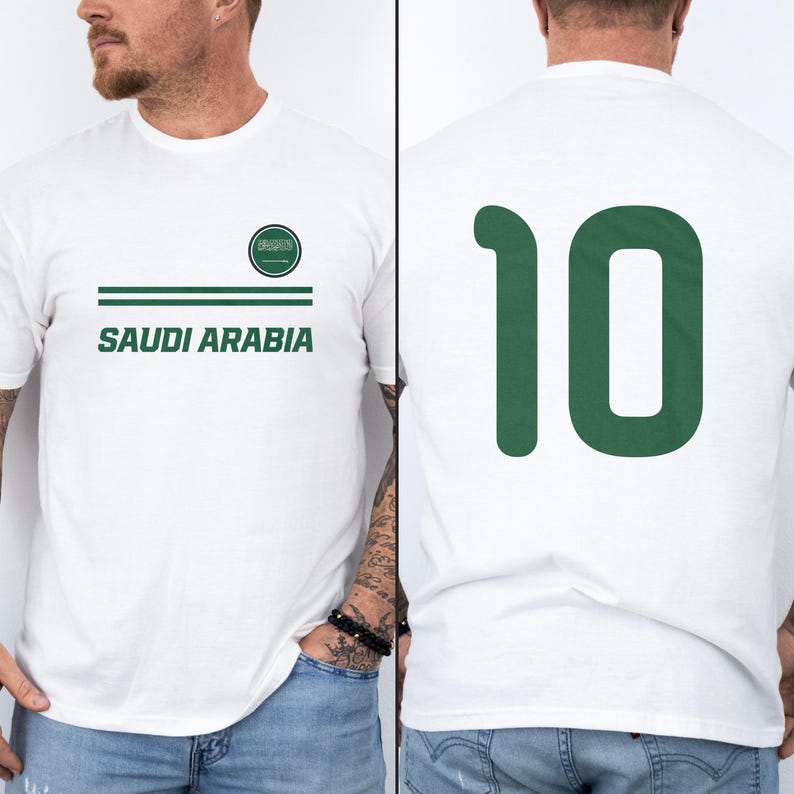 A white t-shirt with the text "SAUDI ARABIA" printed on it, along with a green number "10" on the back.