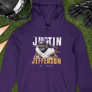 a purple hoodie with a picture of a football player on it
