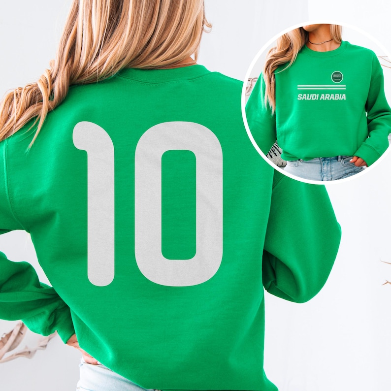 A woman wearing a green sweatshirt with the number 10 on it.