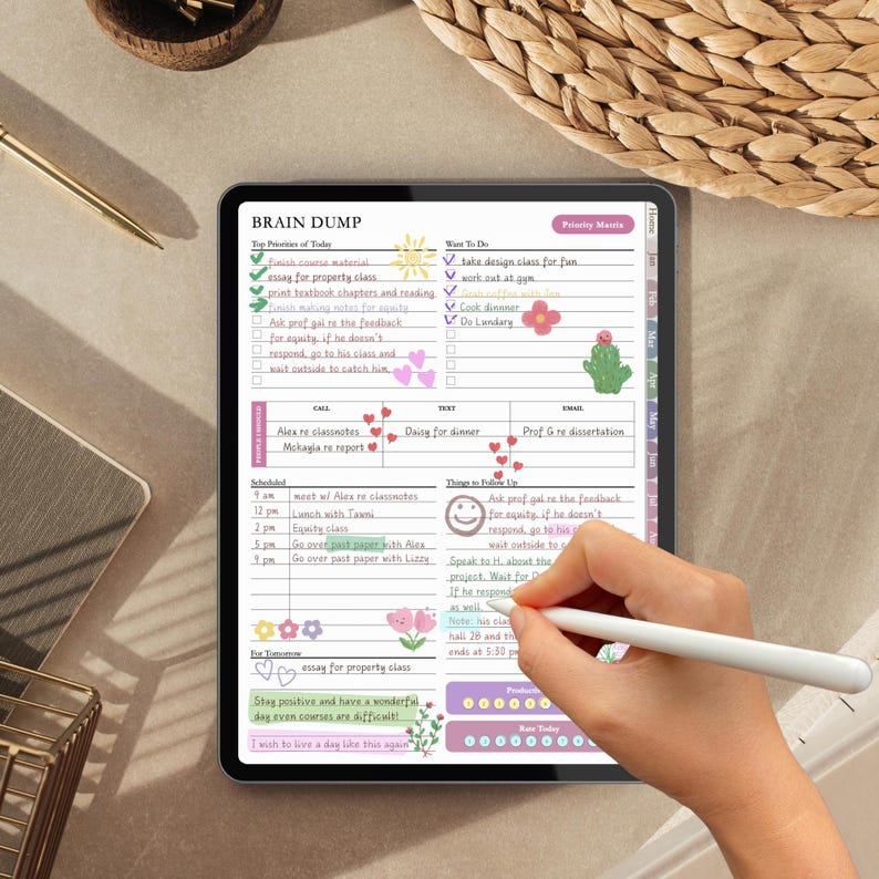 May include: A digital tablet displaying a Brain Dump planner page with handwritten notes, checklists, and colourful floral and heart illustrations. The screen features sections for priorities, tasks, calls, texts, emails, and a schedule with a stylus.