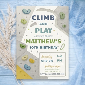 May include: A rectangular birthday invitation card featuring a climbing wall illustration with colorful handholds. The text reads: CLIMB AND PLAY AS WE CELEBRATE MATTHEW'S 10TH BIRTHDAY. Saturday NOV 28 4-6 PM, Rocktopia Gym, 123 Climbing Street, New York, NY 10002.