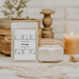 May include: A white wax melt with a black and white label that reads "Glowing Night Froot Loops Hand Poured Wax Melt 2 OZ".