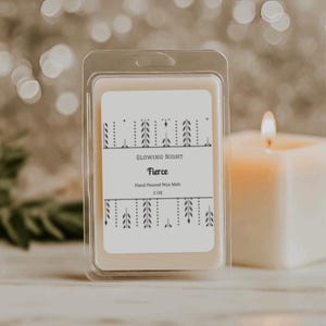 May include: A clear plastic clamshell package containing a hand-poured wax melt. The label reads "Glowing Night Fierce" with a decorative leaf design. A lit candle is in the background. The wax melt weighs 2 oz.