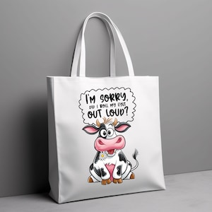 May include: White tote bag featuring a cartoon cow and the text "I'm sorry, did I roll my eyes out loud?"