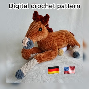 May include: A brown crochet horse toy, with a dark brown mane and tail, and light grey and blue accents on its legs and muzzle. The text "Digital crochet pattern" is at the top of the image.