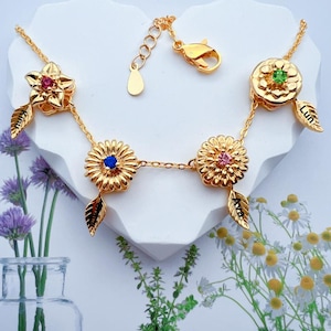 回転する誕生花ネックレス - パーソナライズされた刻印入りの名前と回転する花のチャーム - 12種類の花のモチーフが付いたカスタマイズ可能な誕生月ジュエリー