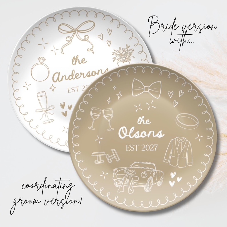 May include: Two round ceramic plates with scalloped edges. One white plate features gold line art of a bow, ring, flowers, and the text "the Andersons EST 2027". One tan plate features white line art of a bowtie, ring, suit, car, and "the Olsons EST 2027".