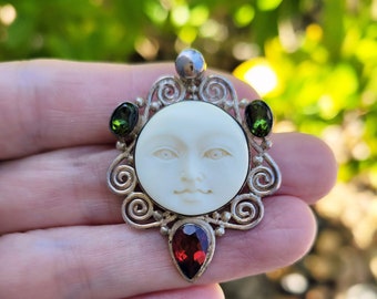 Vintage Sajen Bali sterling silver hand carved moon face bone, green tourmaline and garnet brooch pendant