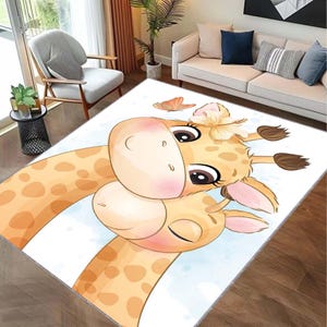 May include: A white rug featuring a cartoon illustration of two giraffes with brown spots. The giraffes are hugging and have large eyes. There is a butterfly and a flower on the rug.