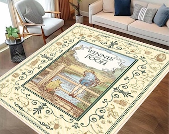 May include: Rectangular area rug featuring a scene from Winnie the Pooh. The rug has a cream-colored background with a central image of Pooh and Christopher Robin. The border includes decorative elements and characters from the story.