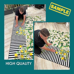 May include: Two black and white striped rugs with a floral and lemon design. The rugs are laid out on a floor and a person is kneeling on each rug. The text "HIGH QUALITY" is printed on the bottom of the image.