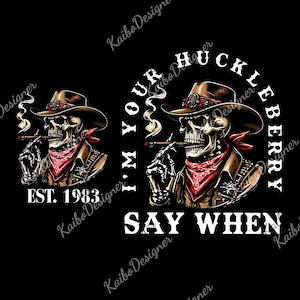 May include: A black graphic design features a skull wearing a cowboy hat, red bandana, and a brown jacket, smoking a cigar. The text "I'M YOUR HUCKLEBERRY SAY WHEN" is displayed. The design also includes "EST. 1983".