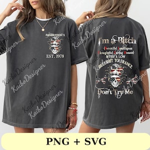 May include: Dark gray t-shirt with a skull graphic wearing sunglasses and an American flag bandana. The front of the shirt reads "GENERATION X EST. 1978". The back of the shirt says "I'm a Bitch" with additional text. The shirt is a casual style.