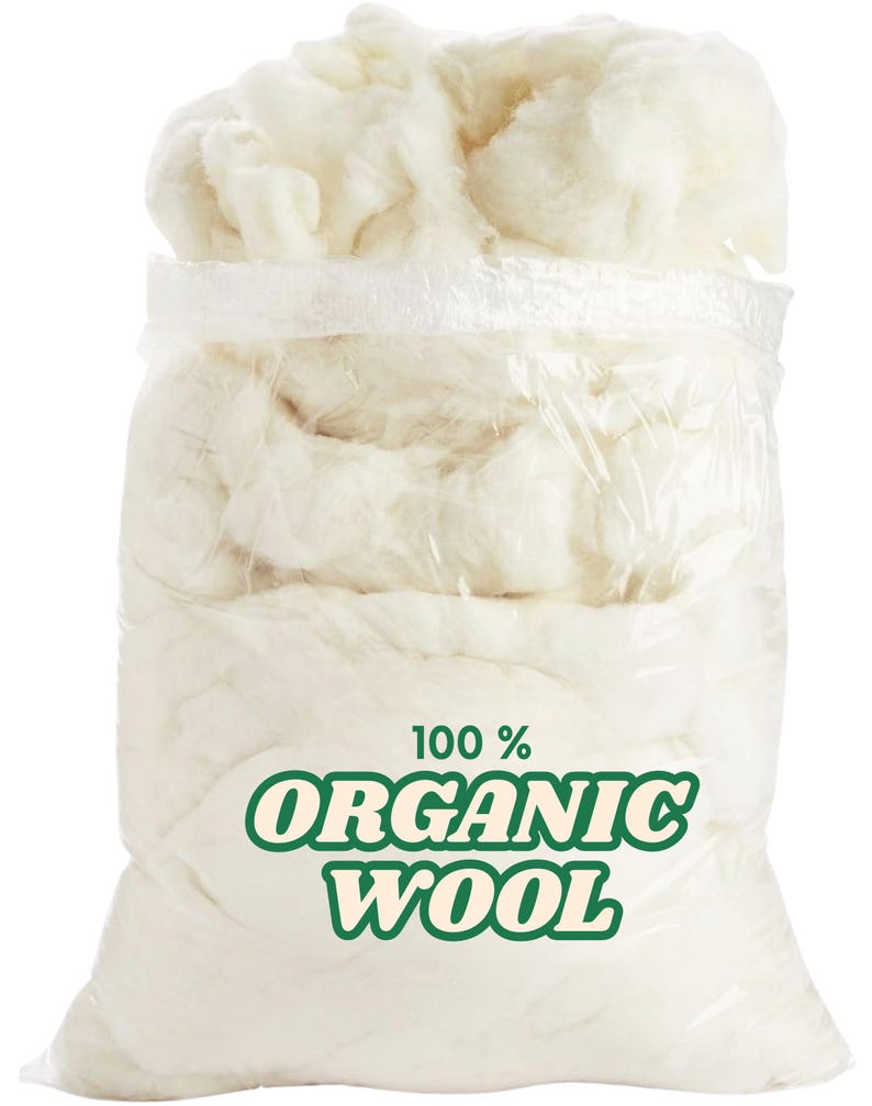 May include: A transparent plastic bag containing a large quantity of off-white organic wool. The bag features a green and white label stating "100% ORGANIC WOOL". The wool appears soft and is loosely packed.