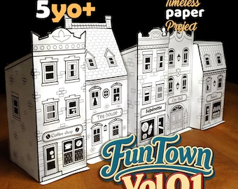 Puede incluir: Un conjunto de edificios de papel blanco con detalles de líneas negras, incluyendo un coffee shop, tea house, supérette, city hall y bakery. El texto 5yo+, Timeless paper Project y FunTown Vol 01 está impreso en la imagen.