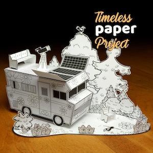May include: A black and white paper craft model of a camper van decorated with flower patterns, featuring a roof-mounted telescope, solar panels, and a bench. The scene includes a paper tree, bushes, and birds, with the text Timeless paper Project.