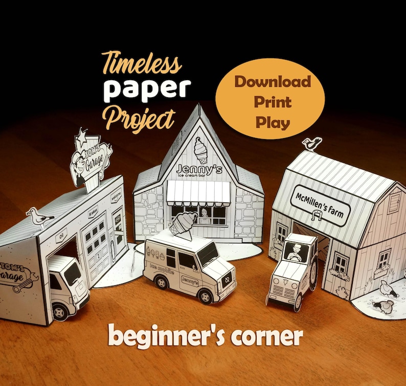 May include: A set of three paper craft buildings including Tom's Garage, Jenny's Ice Cream Bar, and McMillen's farm, accompanied by a paper ice cream truck and a tractor. The text reads Timeless paper Project, Download Print Play, and beginner's corner.