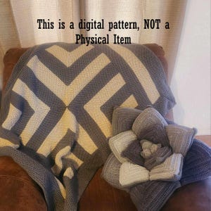 May include: A digital crochet pattern for a gray and beige striped blanket with a matching flower pillow. The text "This is a digital pattern, NOT a Physical Item" is displayed above the blanket.