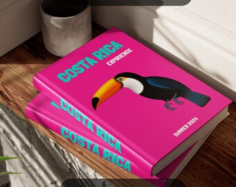 May include: Two pink photo albums with the text "Costa Rica Experience" and "Summer 2024" on the front. The top album features a toucan illustration. The text "Adventure Photo Album" is on the bottom of the image.