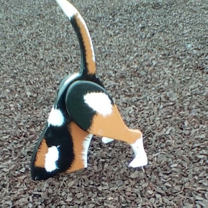 Beagle dog digging lawn ornament garden display