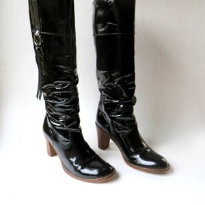 Knee high patent leather boots top