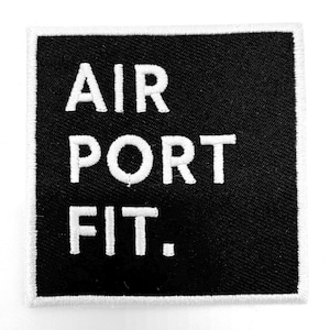 May include: Black embroidered patch with white text that reads "AIR PORT FIT."