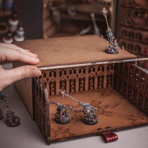 Miniature storage with with removable miniature storage tray for grimdark armies. Warhammer display case for wargame and roleplaying games.