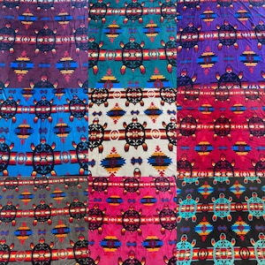 May include: A collection of six fleece blankets with a Native American inspired design featuring a turtle pattern in various colors including teal, blue, purple, red, pink, and gray.