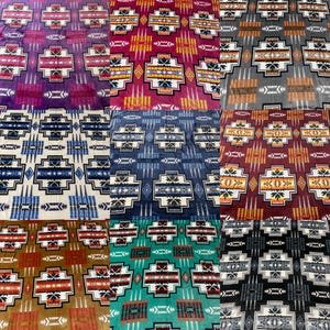 May include: A collection of nine blankets with different geometric patterns in various colors, including purple, red, blue, white, green, and black. The blankets feature a southwestern-inspired design with repeating patterns.