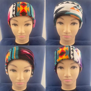 May include: Four different patterned fleece headbands with a black fleece lining. The headbands feature a geometric pattern in shades of blue, green, red, orange, white, and black.