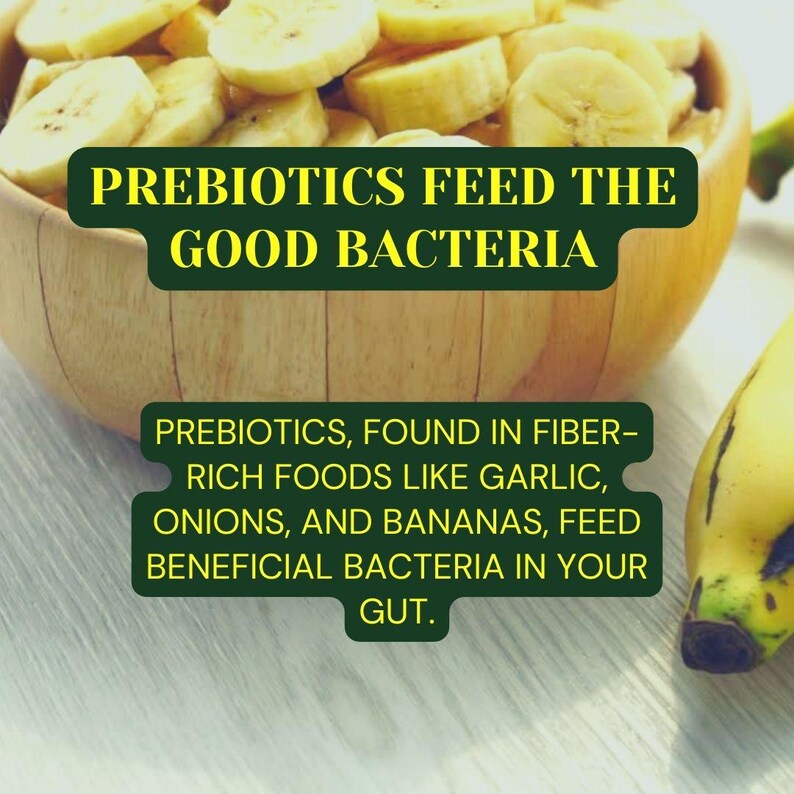 May include: A wooden bowl filled with sliced bananas. The text "PREBIOTICS FEED THE GOOD BACTERIA" is displayed above the bowl. Below the bowl, the text reads "PREBIOTICS, FOUND IN FIBER-RICH FOODS LIKE GARLIC, ONIONS, AND BANANAS, FEED BENEFICIAL BACTERIA IN YOUR GUT."