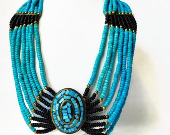 Gorgeous Multi Strands Turquoise and Black Glass Beads with Large Oval Brass and Faux Turquoise Necklace.