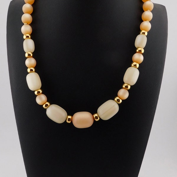 1980s Napier Pale Orange and Cream Lucite with Gold spacers Necklace.