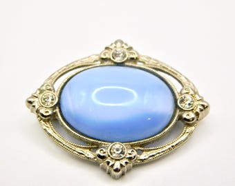 Vintage 1928 Jewelry Silver-tone Blue Glass Clear Rhinestones Oval Brooch