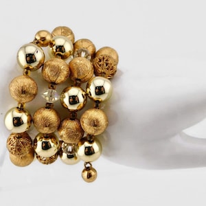 Vintage Gold tone  Metal Beads and Clear  AB Crystals Memory wire Bracelet.