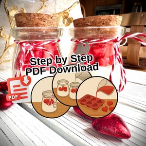 May include: Two glass jars with cork lids, filled with red heart-shaped sweets and white liquid, tied with red and white twine. The text "Step by Step PDF Download" is displayed. Decorative hearts are scattered around.