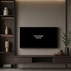 May include: A wall-mounted television with the text YOUR VIDEOS/PHOTOS displayed on the screen, positioned above a dark wood media console. To the left is a tall shelving unit with decorative vases and to the right is a potted green plant.