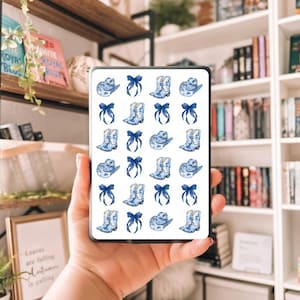 May include: A collection of blue and white cowboy boots, hats, and bows arranged in a repeating pattern. The design is reminiscent of classic blue and white porcelain. The image is displayed on a rectangular device.