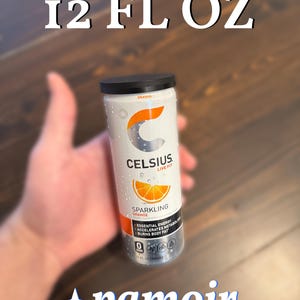 May include: A white and silver Celsius sparkling orange energy drink can with a black lid. The can features the text "CELSIUS LIVE FIT" and "SPARKLING ORANGE". The can is 12 fl oz.