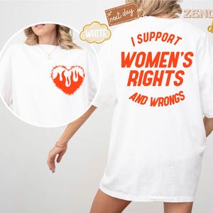May include: White t-shirt with the text "I support women's rights and wrongs" in orange on the back. The front of the shirt has a red heart with flames inside and barbed wire around it.