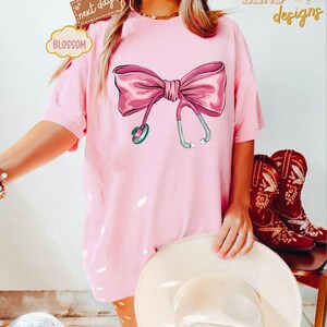 Comfort Colors Coquette Nurse Stethoscope Bow Shirt, Gift for Nurse,Bow Oversized Shirt,Nurse Appreciation,Christmas Gift for Nurse,Pink Bow