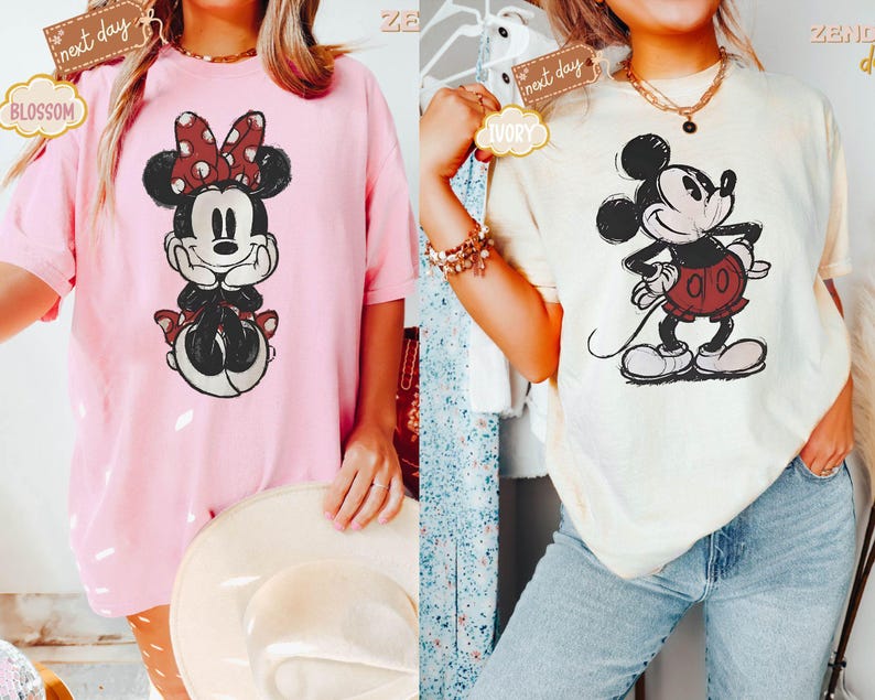 May include: Two t-shirts featuring vintage-style illustrations of Mickey Mouse and Minnie Mouse. The Mickey Mouse shirt is ivory with a black and red illustration. The Minnie Mouse shirt is pink with a black and red illustration.