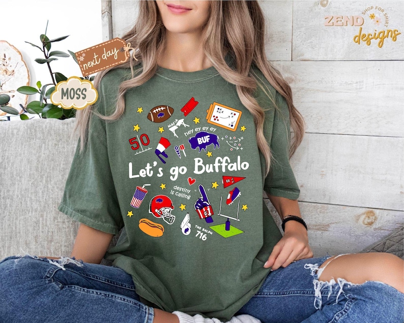 May include: Green t-shirt with the text "Let's go Buffalo" and various graphics, including a football, stars, and a helmet. The shirt also features the number 50 and the text "The Ralph 716".