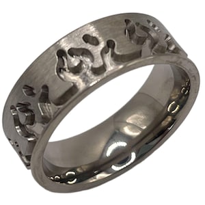 May include: A silver band ring with a brushed finish and a design of stylized flames around the band.