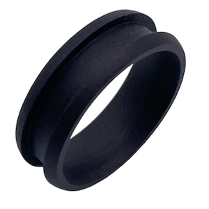 May include: A black rubber ring with a smooth, rounded surface. The ring has a slightly raised edge on one side.