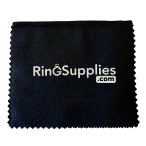 May include: A black microfiber cleaning cloth with the text "RingSupplies.com" printed in white.