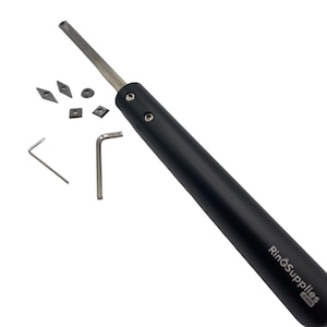May include: A black metal ring mandrel with a black handle and a silver metal blade. The mandrel comes with a set of interchangeable blades and two Allen wrenches. The mandrel is labeled "RingSupplies.com".